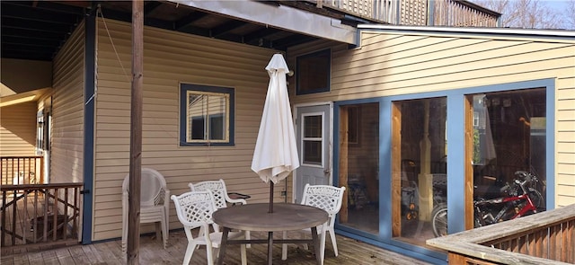 wooden deck with outdoor dining space