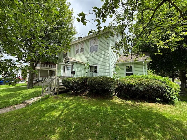 717 Spaulding St, Elmira-City, NY 14904 - rear view of house with a yard