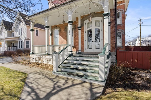 280 S Main St, Canandaigua-City, NY 14424 - property entrance featuring brick siding and a porch