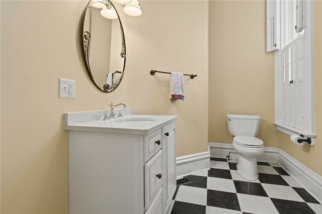 280 S Main St, Canandaigua-City, NY 14424 - bathroom featuring tile patterned floors, vanity, toilet, and baseboards