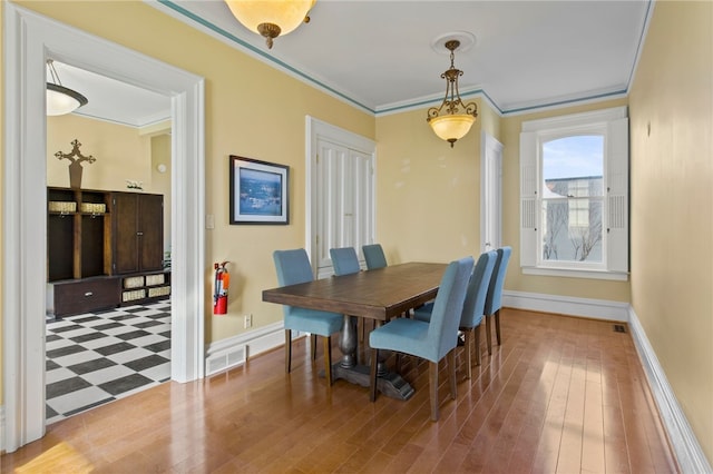 280 S Main St, Canandaigua-City, NY 14424 - dining space with wood finished floors, ornamental molding, baseboards, and visible vents