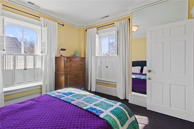 280 S Main St, Canandaigua-City, NY 14424 - bedroom with ornamental molding, dark colored carpet, and visible vents
