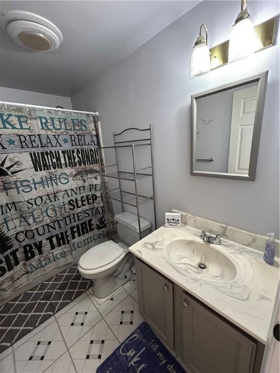 full bathroom with a shower with curtain, tile patterned floors, toilet, and vanity