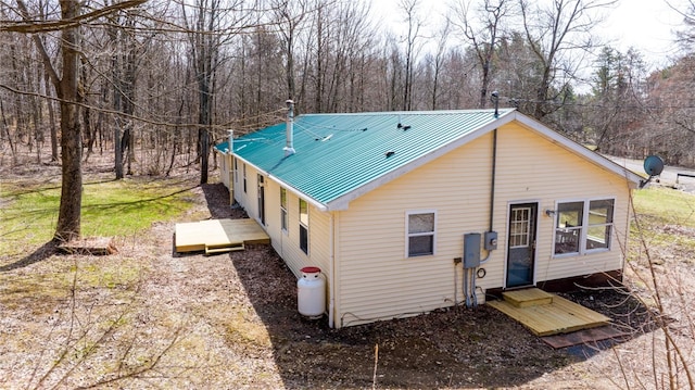 rear view of house with metal roof