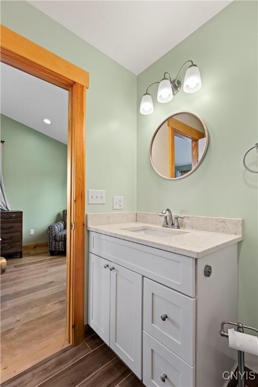 2310 Olanco Rd, Spafford, NY 13110 - bathroom featuring wood finished floors and vanity