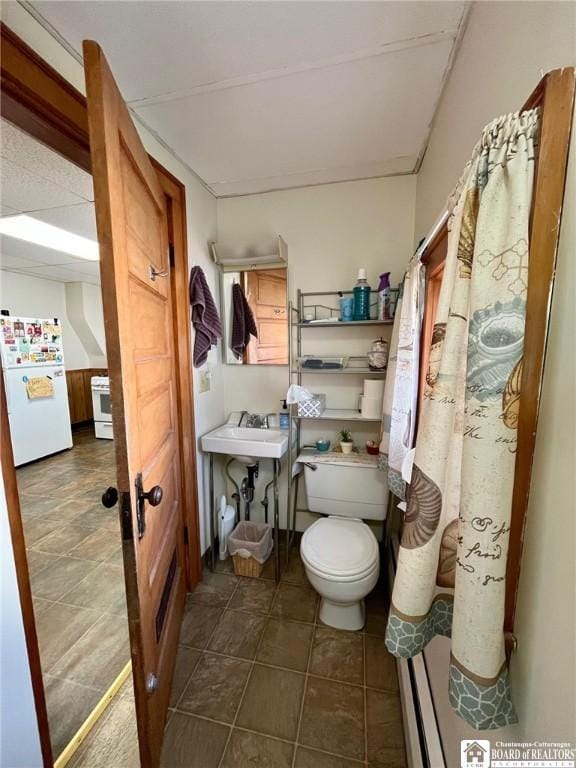 546 S Roberts Rd, Dunkirk-City, NY 14048 - bathroom featuring toilet, tile patterned flooring, and a paneled ceiling