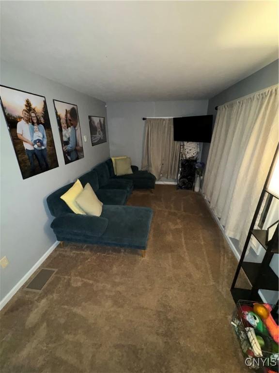 439 S Mechanic St, Wilna, NY 13619 - carpeted living area featuring baseboards
