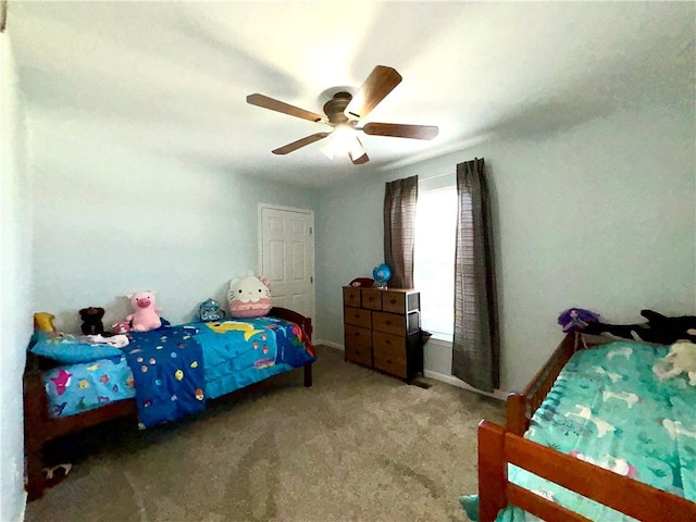 bedroom with baseboards, carpet, and a ceiling fan