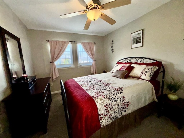 bedroom featuring baseboards, ceiling fan, and carpet