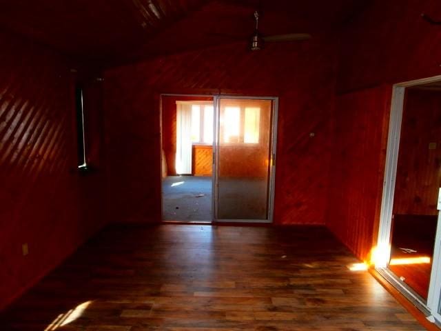 unfurnished room with wood finished floors