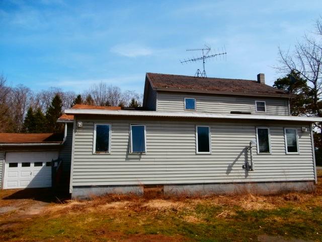 view of side of home with a garage