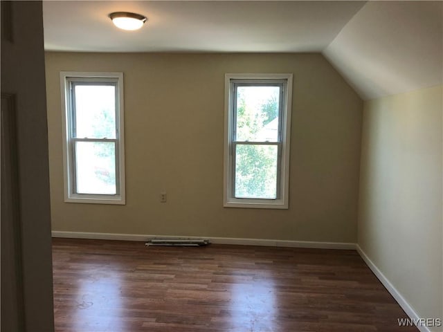 202 Thompson St, Buffalo, NY 14207 - bonus room featuring vaulted ceiling, dark wood-type flooring, and baseboards