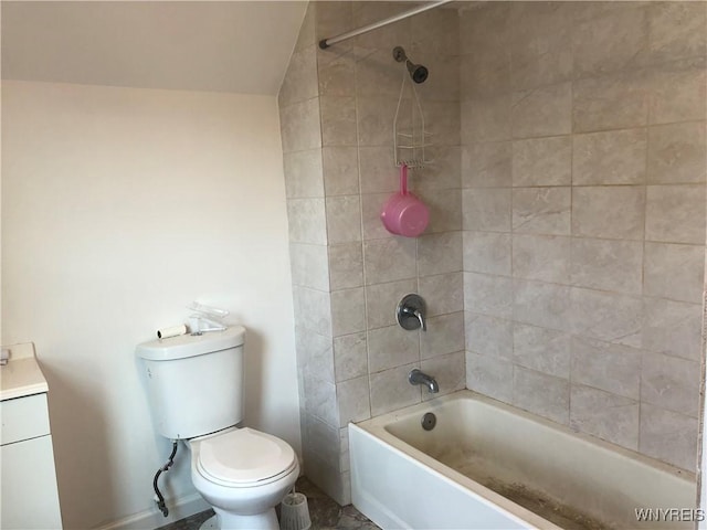 202 Thompson St, Buffalo, NY 14207 - bathroom featuring washtub / shower combination, vaulted ceiling, toilet, baseboards, and vanity