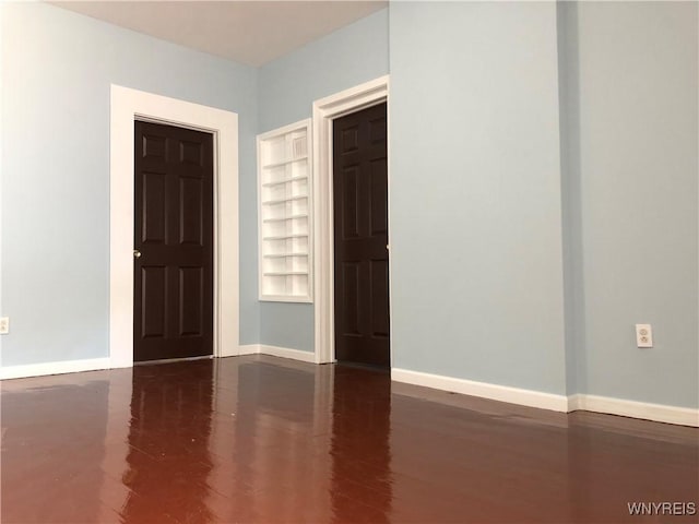 202 Thompson St, Buffalo, NY 14207 - unfurnished room featuring built in features, baseboards, and wood finished floors