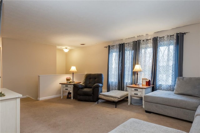 31 Briarcliff Dr, Horseheads, NY 14845 - living area featuring baseboards, a healthy amount of sunlight, and light colored carpet