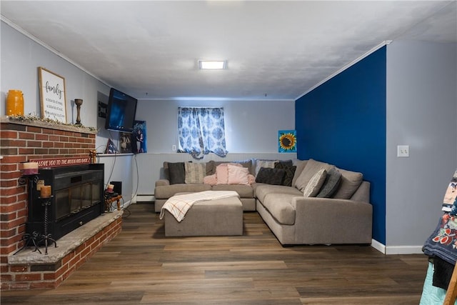 31 Briarcliff Dr, Horseheads, NY 14845 - living room with baseboard heating, wood finished floors, a fireplace, and ornamental molding