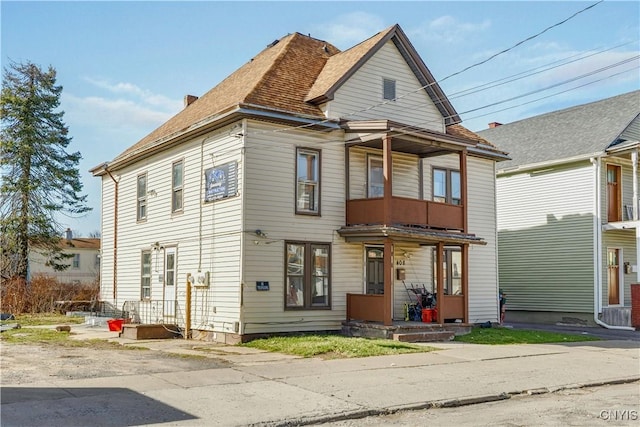 view of front of property with roof with shingles