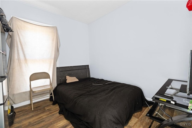 bedroom with wood finished floors