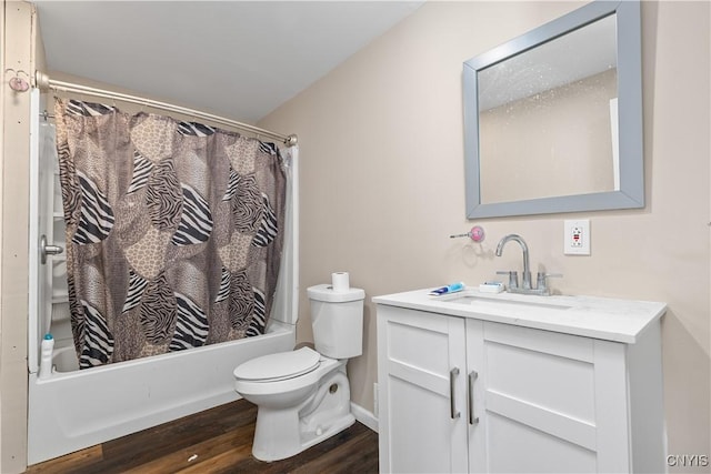 bathroom featuring toilet, shower / tub combo with curtain, vanity, wood finished floors, and baseboards