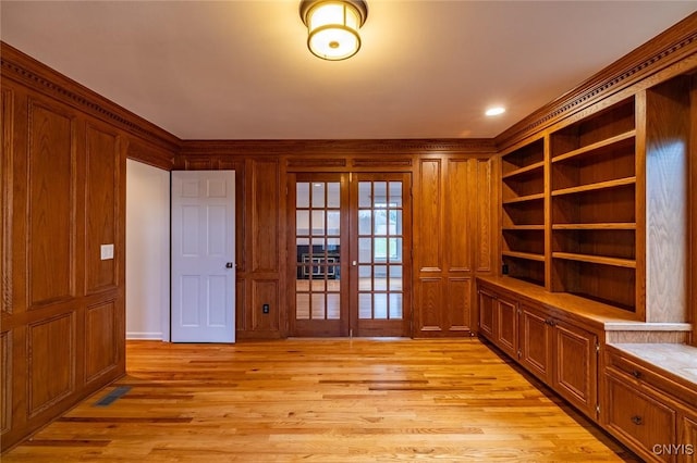 interior space featuring french doors, light wood-style floors, and visible vents