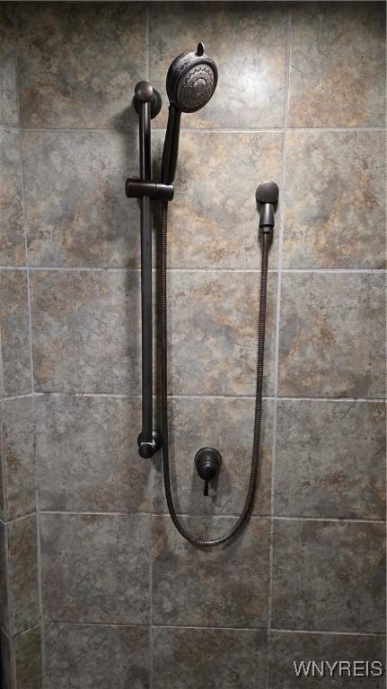 room details with a tile shower