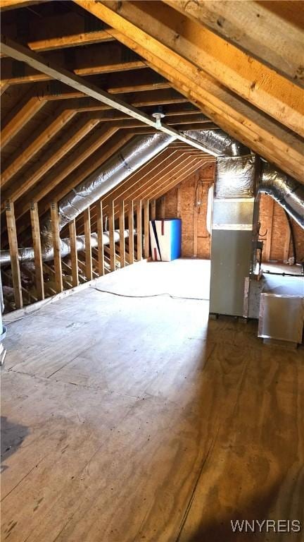 attic featuring heating unit