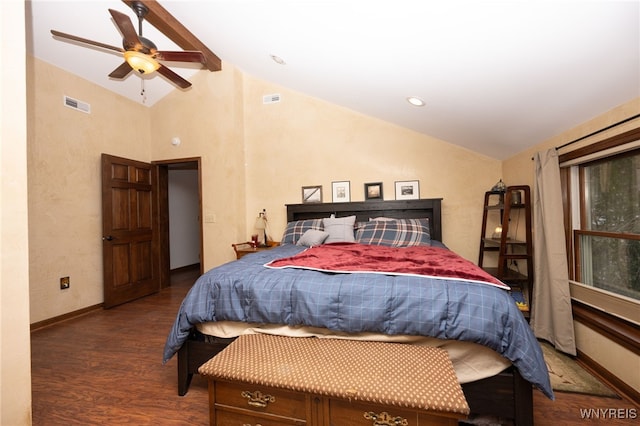 bedroom featuring lofted ceiling, visible vents, baseboards, and wood finished floors