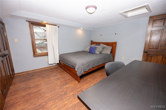 bedroom featuring wood finished floors