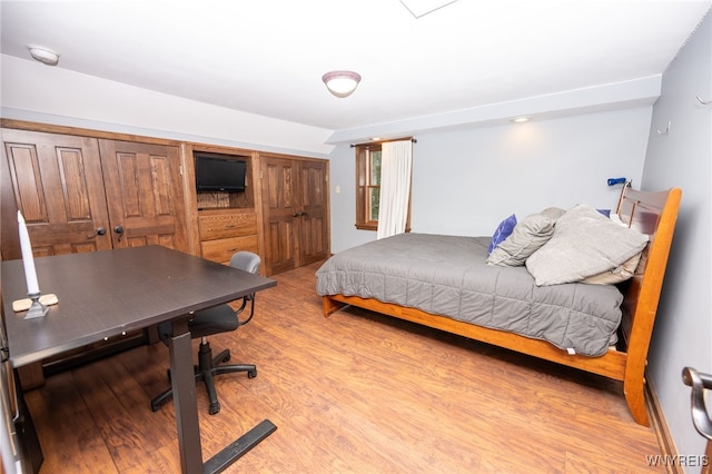 bedroom featuring wood finished floors