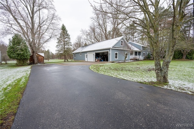 exterior space featuring aphalt driveway