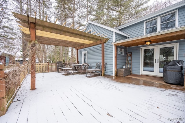 snow covered deck with outdoor dining area, grilling area, and french doors