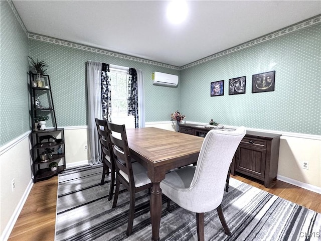 14 Barley Mow Run, New Hartford, NY 13413 - dining space with wood finished floors, an AC wall unit, baseboards, wallpapered walls, and wainscoting