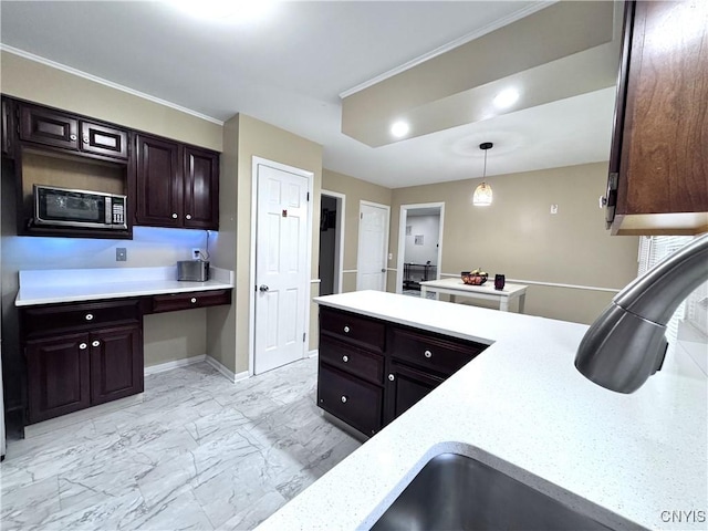 14 Barley Mow Run, New Hartford, NY 13413 - kitchen with baseboards, built in desk, marble finish floor, dark brown cabinetry, and decorative light fixtures