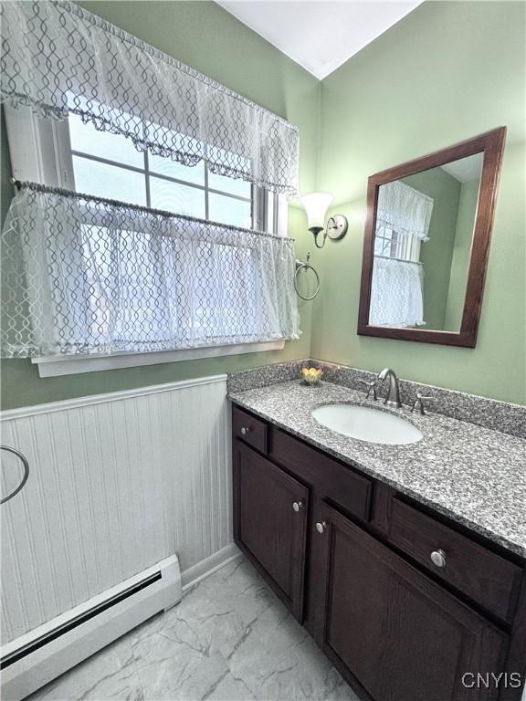 14 Barley Mow Run, New Hartford, NY 13413 - bathroom with marble finish floor, vanity, and a baseboard heating unit