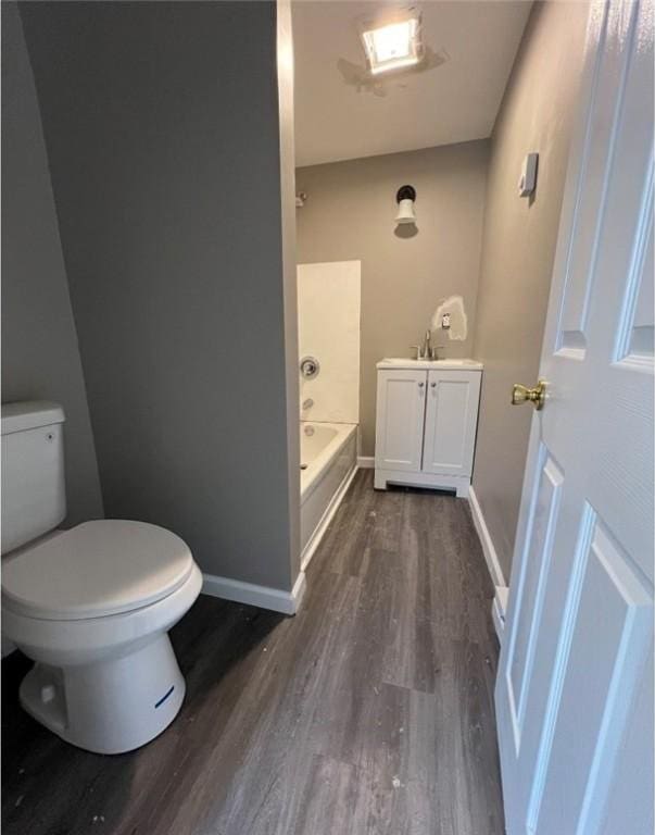 200 Henry St, Montour, NY 14865 - bathroom featuring baseboards, toilet, and wood finished floors