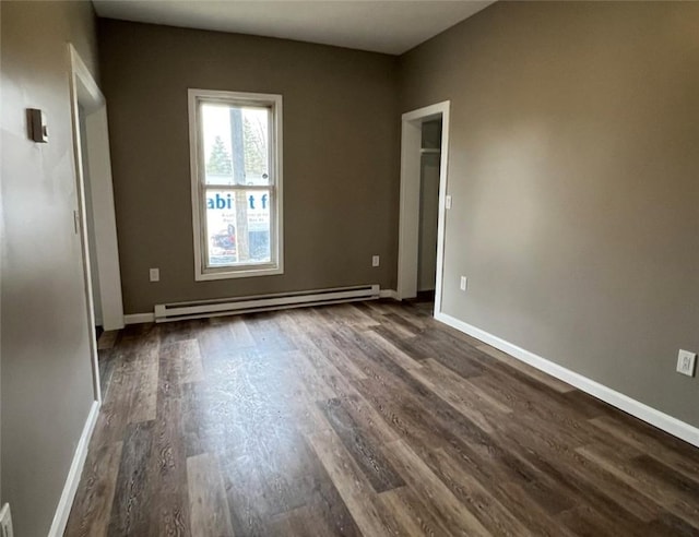 200 Henry St, Montour, NY 14865 - spare room featuring dark wood-style flooring, a baseboard radiator, and baseboards