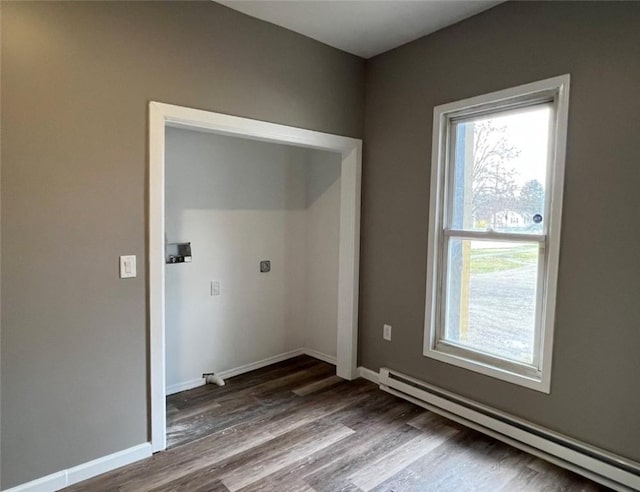 200 Henry St, Montour, NY 14865 - laundry room featuring dark wood-style floors, a baseboard heating unit, and baseboards