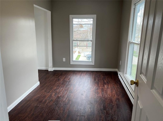 200 Henry St, Montour, NY 14865 - spare room featuring wood finished floors, a baseboard heating unit, and baseboards