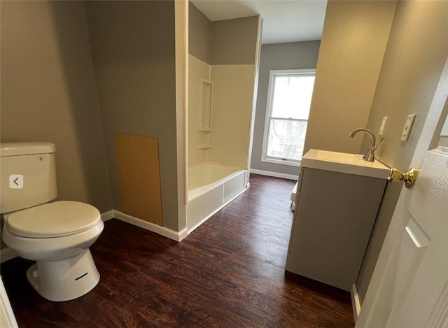 200 Henry St, Montour, NY 14865 - bathroom featuring vanity, baseboards, toilet, bathtub / shower combination, and wood finished floors
