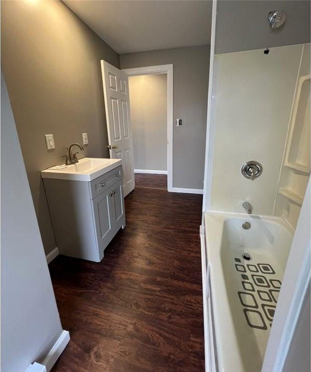 200 Henry St, Montour, NY 14865 - bathroom featuring baseboards, vanity, and wood finished floors