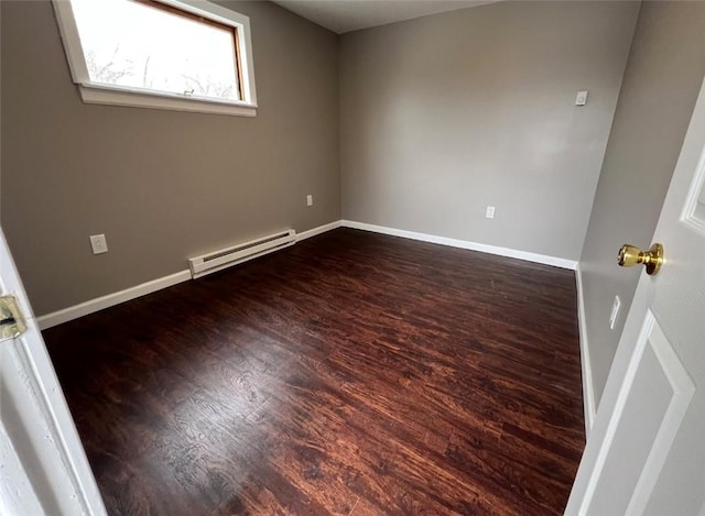 200 Henry St, Montour, NY 14865 - empty room featuring wood finished floors, a baseboard heating unit, and baseboards