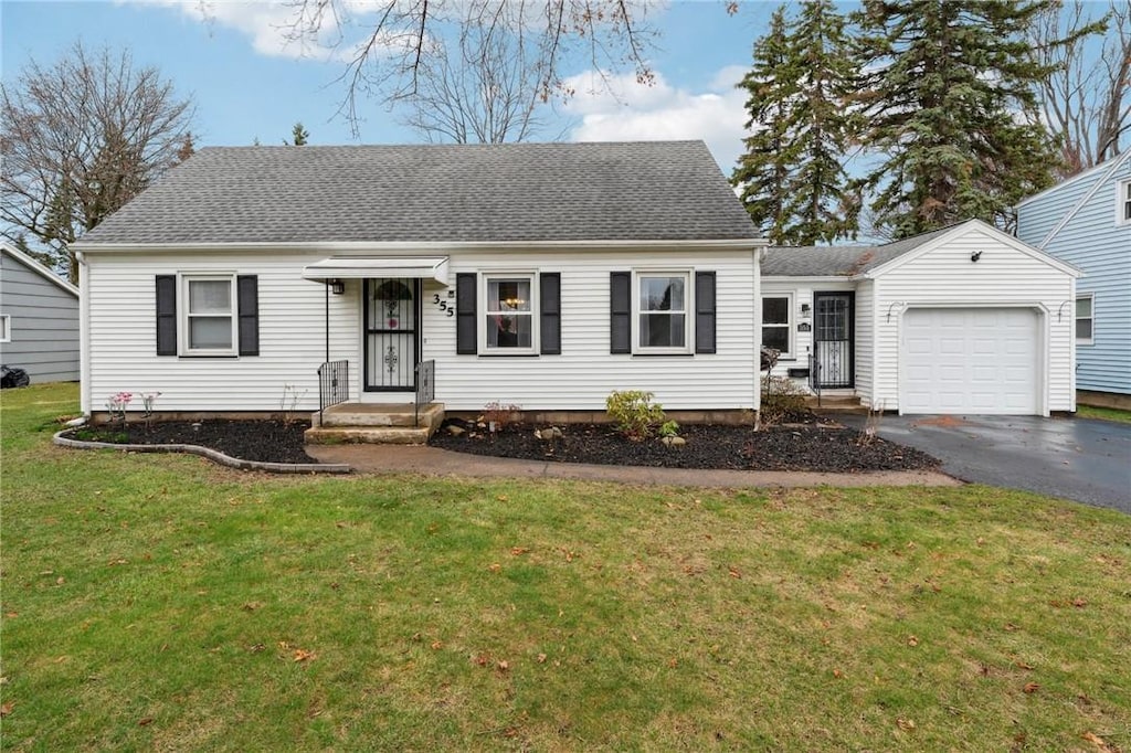 355 Lake Meadow Dr, Greece, NY 14612 - view of front of home featuring roof with shingles, driveway, a front lawn, and an attached garage