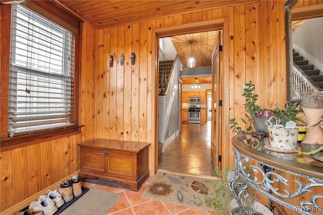 2831 S Park Ave, Lackawanna, NY 14218 - interior space with wooden walls, stairway, light tile patterned flooring, and wood ceiling