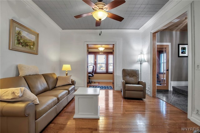 2831 S Park Ave, Lackawanna, NY 14218 - living area featuring crown molding, baseboards, a ceiling fan, and hardwood / wood-style floors