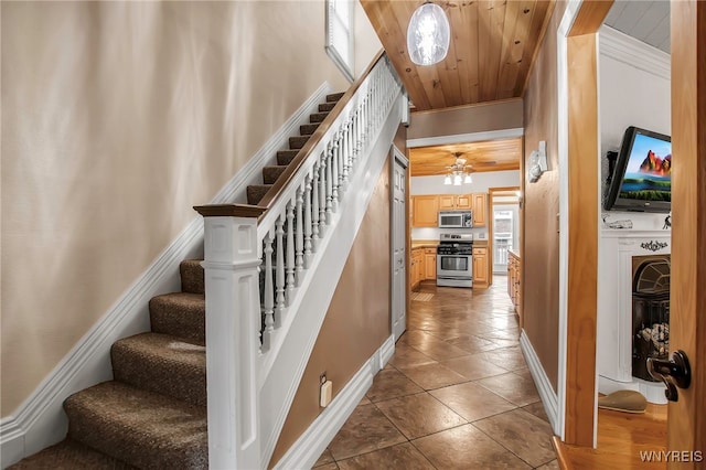 2831 S Park Ave, Lackawanna, NY 14218 - stairway with wooden ceiling, baseboards, and tile patterned flooring