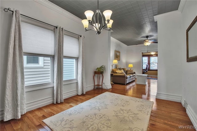 2831 S Park Ave, Lackawanna, NY 14218 - interior space featuring baseboards, ornamental molding, ceiling fan with notable chandelier, and wood finished floors