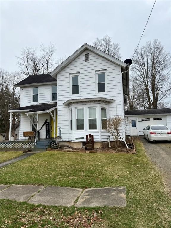 35 Sand St, Afton, NY 13730 - view of front facade with a front yard and a garage