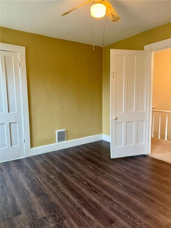35 Sand St, Afton, NY 13730 - unfurnished room featuring dark wood-style flooring, visible vents, baseboards, and ceiling fan