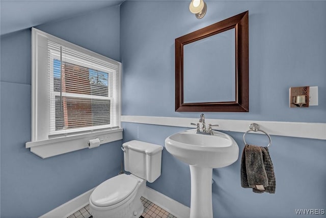 39 Days Park, Buffalo, NY 14201 - bathroom with toilet, tile patterned flooring, baseboards, and a sink