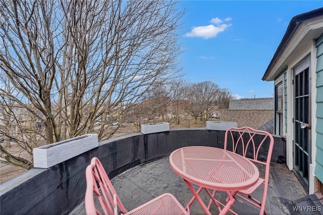 balcony featuring a patio area and outdoor dining area